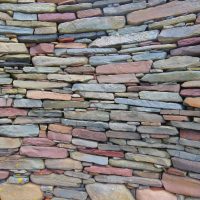 Picture of a multi-coloured stacked stone wall